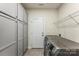 Well-organized laundry room with cabinets and included washer/dryer at 2525 Surveyor General Dr, Waxhaw, NC 28173