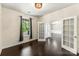 Open living area featuring hardwood floors, natural light, and arched doorways at 2525 Surveyor General Dr, Waxhaw, NC 28173
