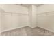 Walk-in closet features wire shelving and carpeted floor at 2525 Surveyor General Dr, Waxhaw, NC 28173