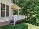 Back porch featuring white railings and exterior home details with manicured lawn at 2545 Chasewater Dr, Fort Mill, SC 29707