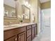 Bathroom with double vanity, framed mirrors, cabinetry, and tile floors, providing style and functionality at 2545 Chasewater Dr, Fort Mill, SC 29707