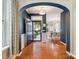 Stunning foyer featuring a grand archway, gleaming hardwood floors, and an inviting, light-filled entryway at 2545 Chasewater Dr, Fort Mill, SC 29707