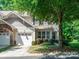 Inviting home exterior showcasing a well-maintained front yard, a garage, and appealing architectural details at 2545 Chasewater Dr, Fort Mill, SC 29707