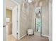 Hallway featuring access to bathroom and mirror that reflects view of chandelier and hallway at 2545 Chasewater Dr, Fort Mill, SC 29707