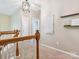 Upstairs hallway with a decorative lighting fixture and views to other rooms at 2545 Chasewater Dr, Fort Mill, SC 29707