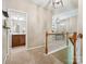 Upstairs hallway with wooden railing, a view into a bathroom and a living area at 2545 Chasewater Dr, Fort Mill, SC 29707