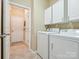 Convenient laundry room with appliances, cabinetry, and tile flooring, offering functionality and storage at 2545 Chasewater Dr, Fort Mill, SC 29707