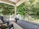 Inviting covered porch with comfortable seating area, perfect for enjoying the outdoors at 2545 Chasewater Dr, Fort Mill, SC 29707