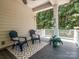 Inviting covered porch with comfortable seating area, perfect for enjoying the outdoors at 2545 Chasewater Dr, Fort Mill, SC 29707