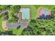 Aerial view of the pool, tennis court, parking, and amenities at 3212 Ashwell Oaks Ln, Matthews, NC 28105