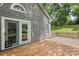 A wooden back deck with sliding glass door, leading to a small fenced backyard at 3212 Ashwell Oaks Ln, Matthews, NC 28105