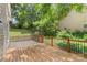 An open wooden back deck is surrounded by a wooden fence with a view of the backyard at 3212 Ashwell Oaks Ln, Matthews, NC 28105