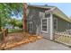 A sunny wooden back deck is attached to the house and backyard with privacy fence at 3212 Ashwell Oaks Ln, Matthews, NC 28105
