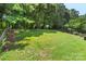 The luscious green backyard is fenced in, creating a private outdoor oasis at 3212 Ashwell Oaks Ln, Matthews, NC 28105