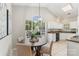 Eat-in kitchen featuring a large window overlooking the yard at 3212 Ashwell Oaks Ln, Matthews, NC 28105