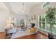 Bright living room features vaulted ceilings, hardwood floors, and a cozy fireplace at 3212 Ashwell Oaks Ln, Matthews, NC 28105