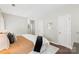 Spacious main bedroom showcasing wood floors, neutral paint, and a view of the home's interior at 3212 Ashwell Oaks Ln, Matthews, NC 28105