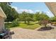The backyard features a stamped concrete patio surrounded by lush greenery and mature trees at 327 Johnson Dairy Rd, Mooresville, NC 28115