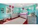 Delightful Bedroom features colorful decor, wood floors, and ample natural light from a large window at 327 Johnson Dairy Rd, Mooresville, NC 28115