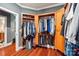 Walk-in closet features custom wood shelving and rods for hanging clothes and storing accessories at 327 Johnson Dairy Rd, Mooresville, NC 28115