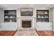 Close-up of a fireplace with custom built-ins and decorative tile work at 327 Johnson Dairy Rd, Mooresville, NC 28115