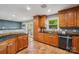 Well-appointed kitchen featuring a black appliance package, beautiful cabinetry, and tile floors at 327 Johnson Dairy Rd, Mooresville, NC 28115