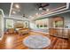 Spacious main bedroom features hardwood floors, recessed lighting, ceiling fans, and a large window at 327 Johnson Dairy Rd, Mooresville, NC 28115