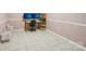 Home office space features tile flooring and a computer desk setup at 327 Johnson Dairy Rd, Mooresville, NC 28115