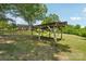 Rustic outbuilding structure provides a unique backyard focal point at 327 Johnson Dairy Rd, Mooresville, NC 28115