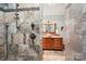 Walk-in shower features decorative tile, stone walls, and brushed metal fixtures near a granite vanity at 327 Johnson Dairy Rd, Mooresville, NC 28115