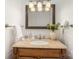 Bathroom showcasing a granite vanity and well-lit mirror, creating an inviting and functional space at 3427 Wonderland Dr, Matthews, NC 28104