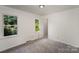 Bedroom filled with natural light, with neutral colored carpet and walls at 3427 Wonderland Dr, Matthews, NC 28104