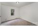 Bright bedroom features neutral carpet, white walls, one window and ceiling light at 3427 Wonderland Dr, Matthews, NC 28104