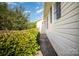 Well-maintained home exterior with neat landscaping and a pathway leading to the entrance at 3427 Wonderland Dr, Matthews, NC 28104