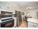An open-concept kitchen and dining area is equipped with modern appliances and offers great flow at 3427 Wonderland Dr, Matthews, NC 28104