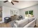 Modern living room with a ceiling fan, stylish furnishings, and sliding glass doors to the outside deck at 3427 Wonderland Dr, Matthews, NC 28104