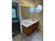 Bathroom with double sink vanity with a large mirror and plenty of lighting at 3617 Betterton Ln, Charlotte, NC 28269