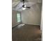 Bedroom featuring a ceiling fan, neutral walls, carpet and a window for natural light at 3617 Betterton Ln, Charlotte, NC 28269