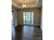 Neutral dining room with hardwood floors, bright window, and decorative chandelier at 3617 Betterton Ln, Charlotte, NC 28269