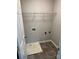A well-lit laundry room featuring tile flooring and convenient washer/dryer hookups at 3617 Betterton Ln, Charlotte, NC 28269
