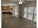 Open-concept living space with hardwood floors, lots of natural light and modern appliances at 3617 Betterton Ln, Charlotte, NC 28269