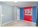 Simple bedroom with neutral carpet, gray walls, and unique NY logo wall art at 394 Link Dr, Iron Station, NC 28080