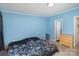 Bedroom featuring blue walls, carpet, and closet at 394 Link Dr, Iron Station, NC 28080