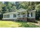 Charming single-Gathering home with a cozy front porch and well-maintained lawn at 394 Link Dr, Iron Station, NC 28080