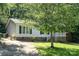 This single-Gathering home features a covered porch and convenient driveway at 394 Link Dr, Iron Station, NC 28080