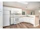 Bright kitchen featuring white cabinets, a modern backsplash, and stainless steel appliances at 394 Link Dr, Iron Station, NC 28080