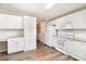Efficient kitchen features white cabinets and stainless appliances at 394 Link Dr, Iron Station, NC 28080