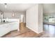 Inviting kitchen with white cabinetry, granite countertops, and wood flooring at 394 Link Dr, Iron Station, NC 28080