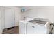 Convenient laundry room with modern washer and dryer, plus storage shelf at 394 Link Dr, Iron Station, NC 28080