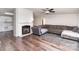Features a fireplace, hardwood flooring, and an open layout, seamlessly connecting to the kitchen at 394 Link Dr, Iron Station, NC 28080